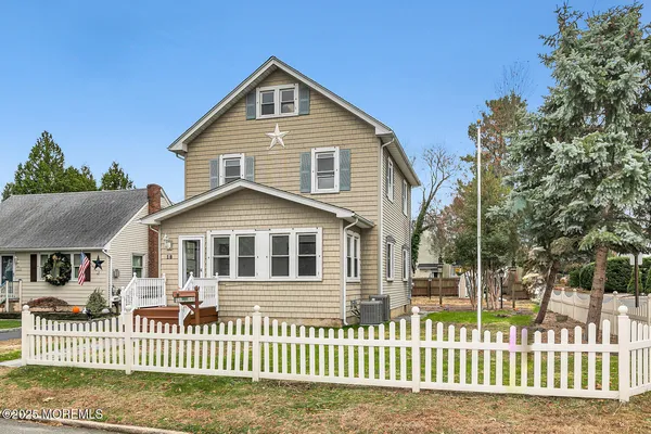 a front view of a house with a fence