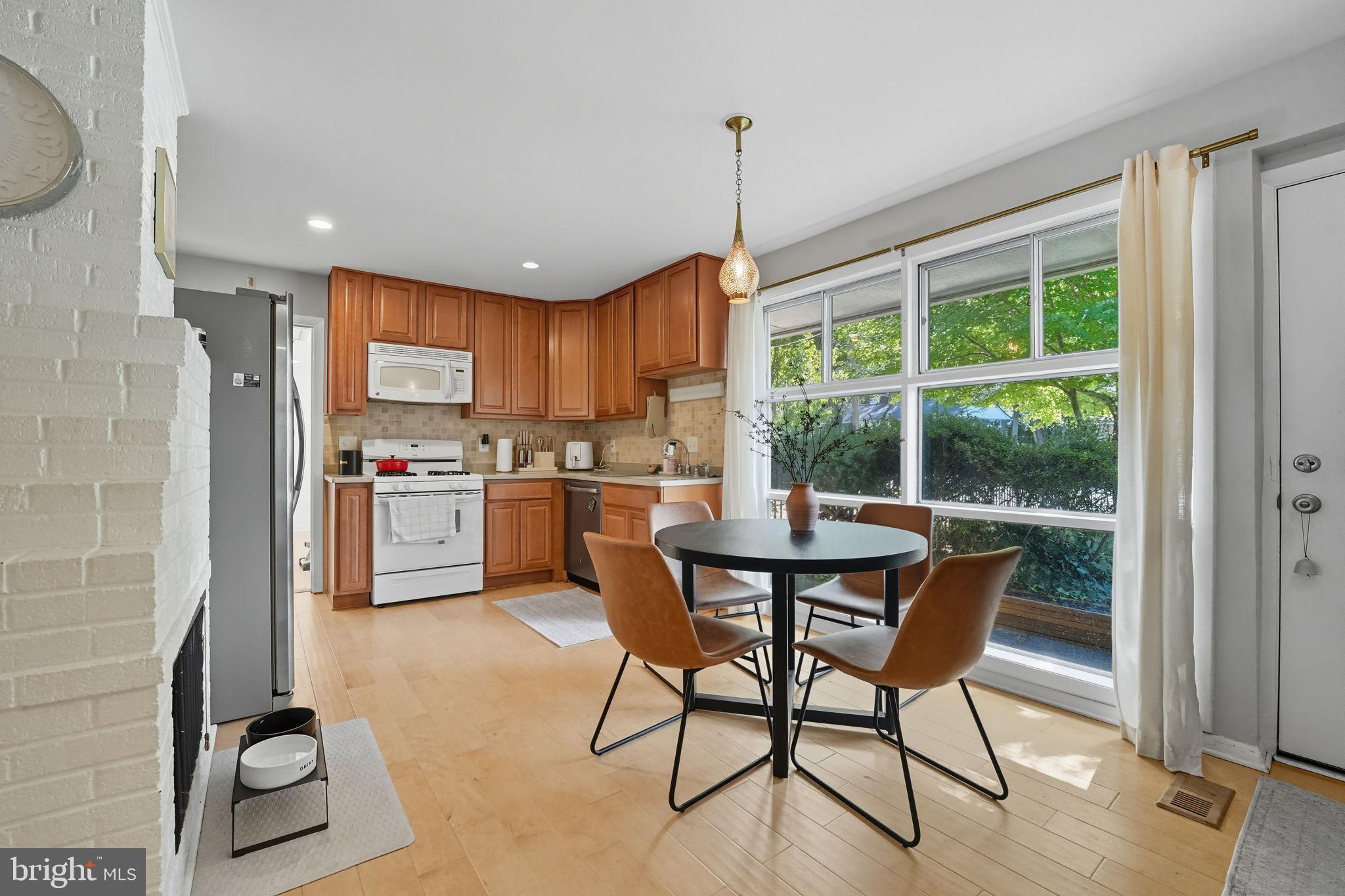 7317 Floyd Avenue Springfield, VA 22150 - Photo 11 of 33 Bright and inviting kitchen with modern charm.