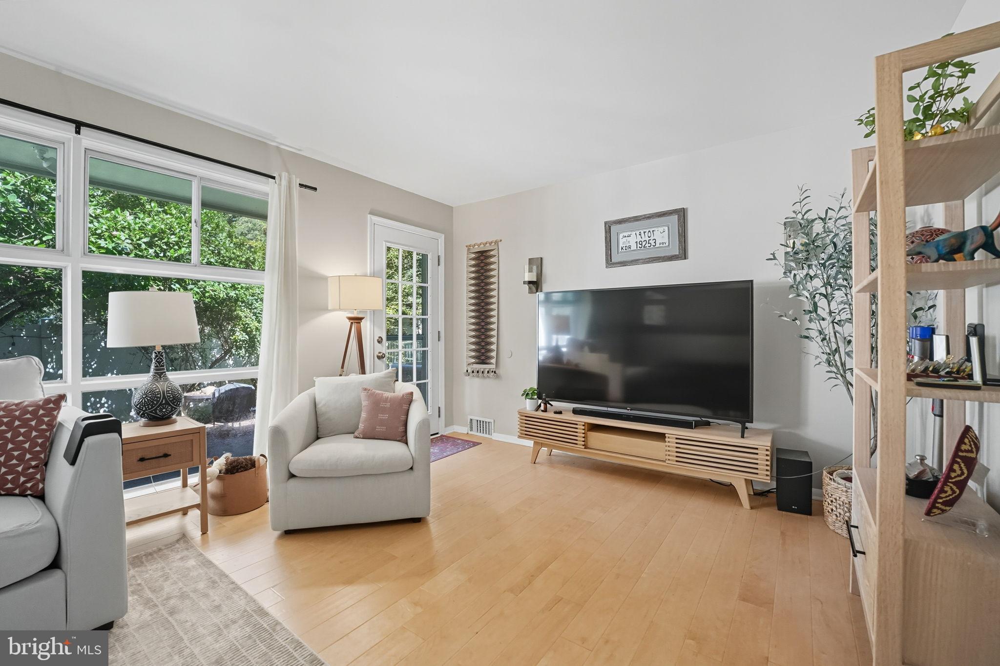 7317 Floyd Avenue Springfield, VA 22150 - Photo 14 of 33 Bright and inviting living space with greenery.