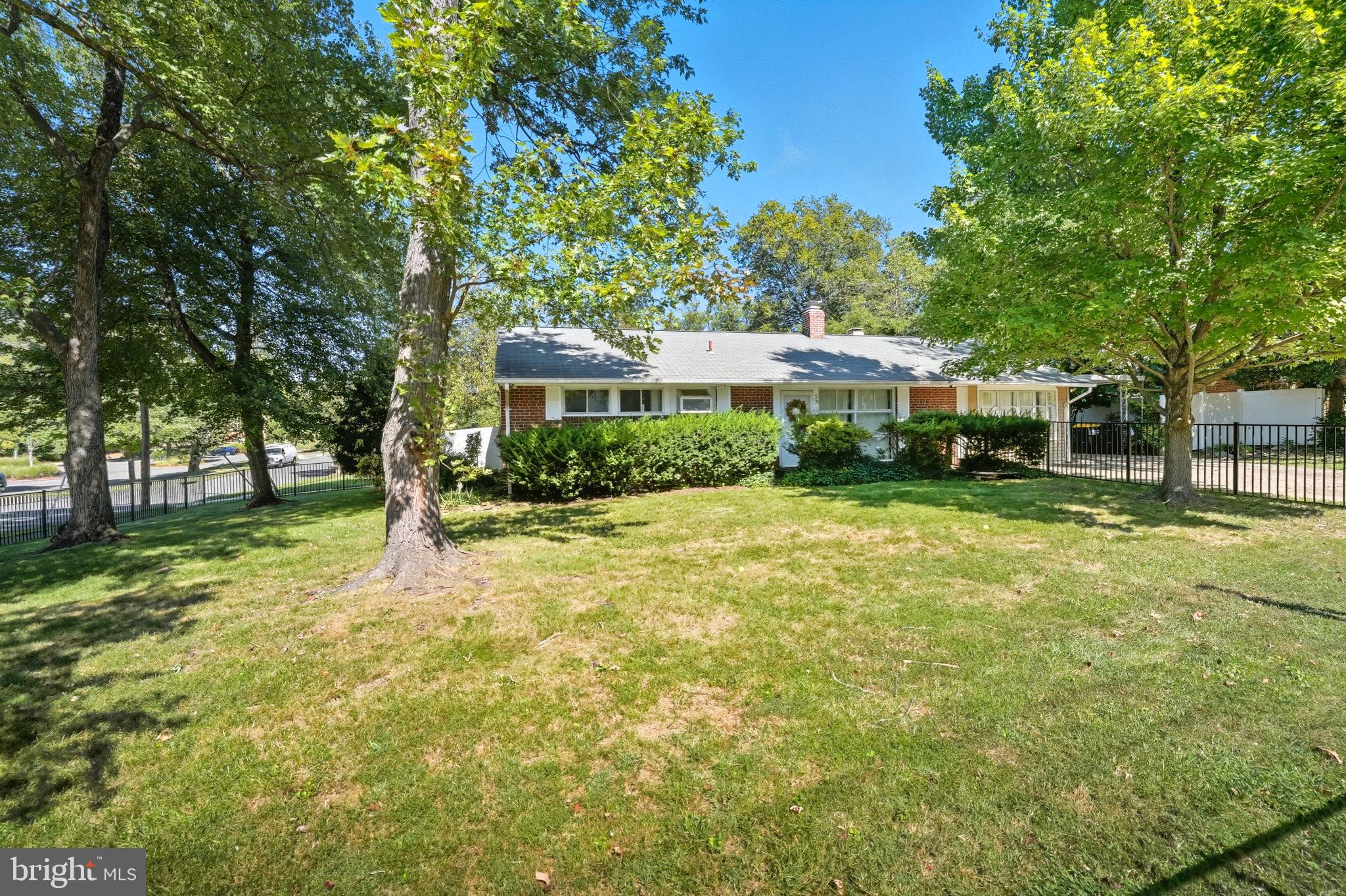 7317 Floyd Avenue Springfield, VA 22150 - Photo 2 of 33 Charming home nestled among lush greenery.