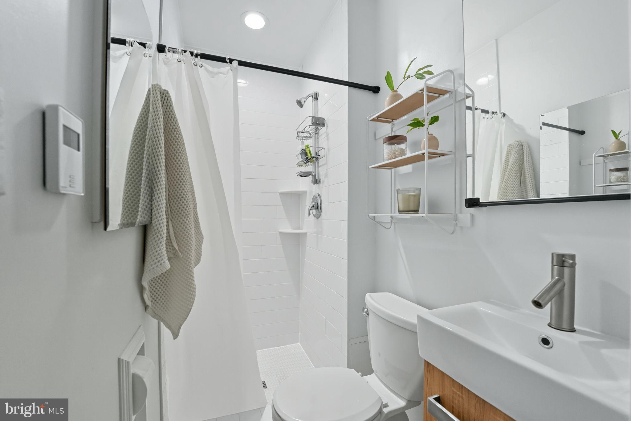 7317 Floyd Avenue Springfield, VA 22150 - Photo 26 of 33 Modern bathroom with sleek design elements.