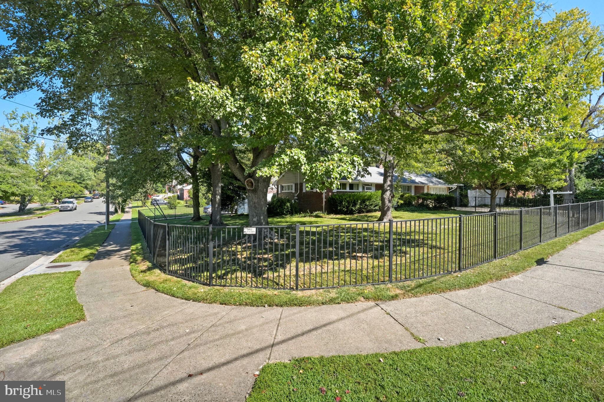 7317 Floyd Avenue Springfield, VA 22150 - Photo 3 of 33 Charming home with lush greenery and fence.