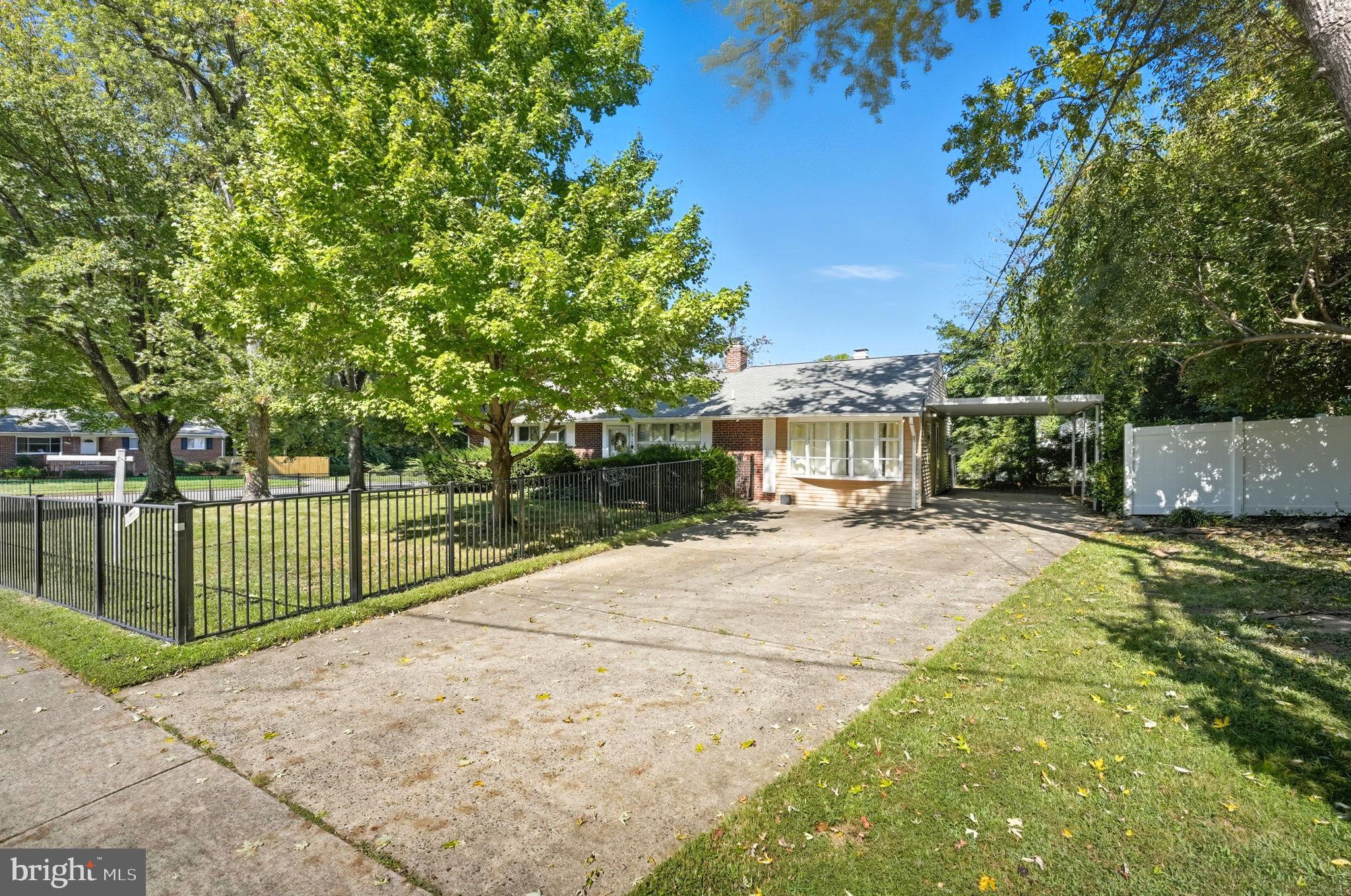 7317 Floyd Avenue Springfield, VA 22150 - Photo 4 of 33 Charming home with lush greenery and space.