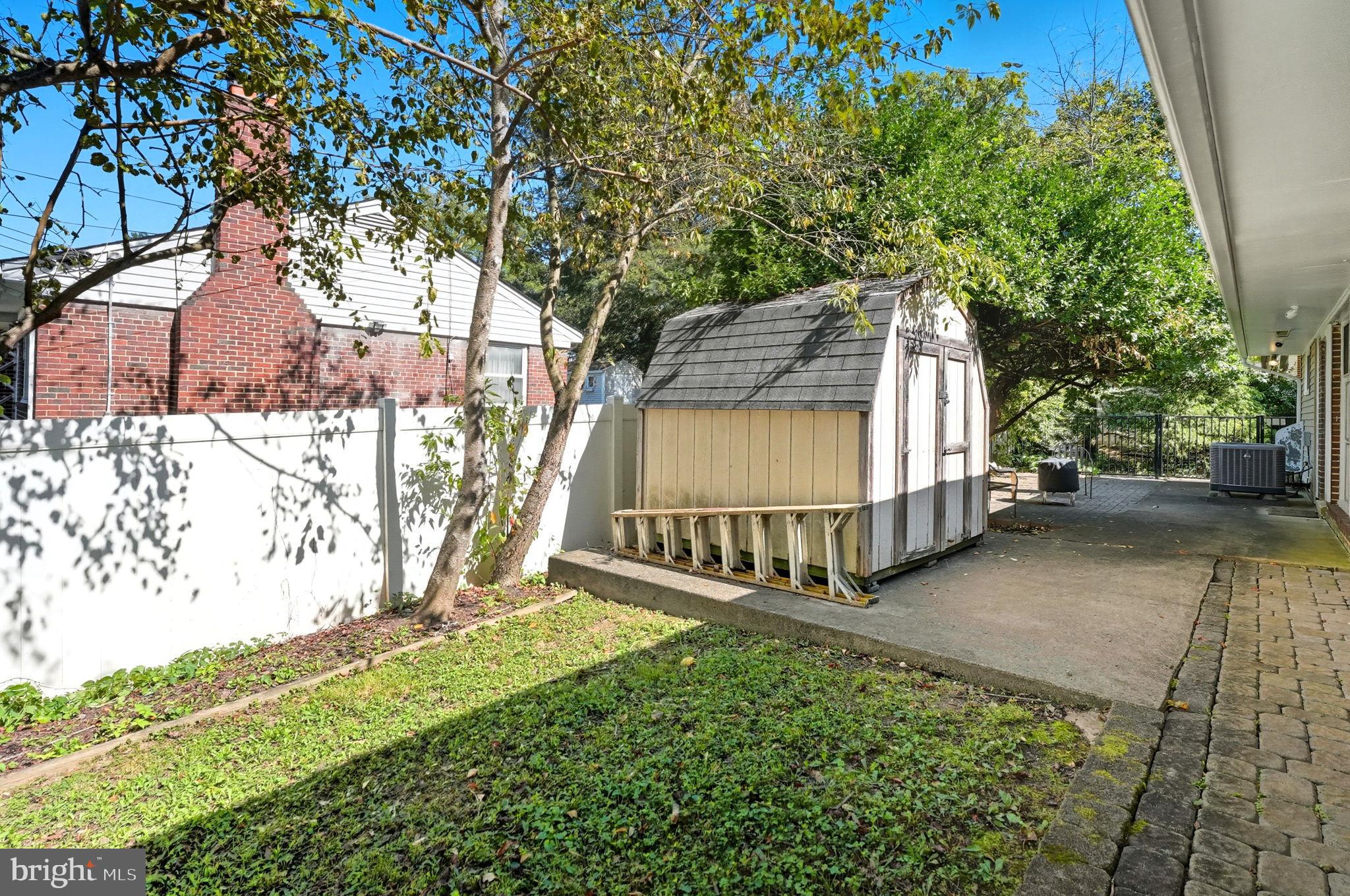 7317 Floyd Avenue Springfield, VA 22150 - Photo 6 of 33 Charming backyard with storage shed oasis.