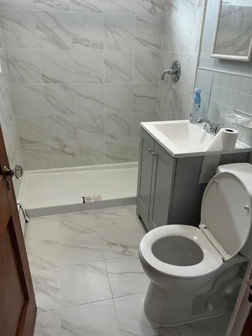 a bathroom with a toilet and a sink