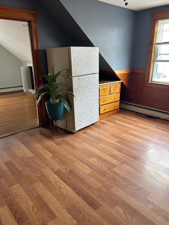21 Wilson Street, Unit 3 Salem, MA 01970 - Photo 7 of 14 a view of a room with wooden floor and windows