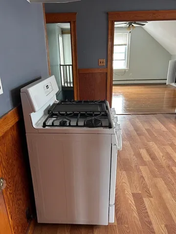 a close view of a sink a faucet and a stove in a room