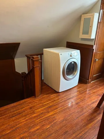 a view of a storage & utility room with wooden floor