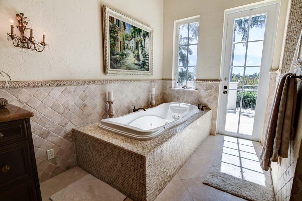 1054 Melaleuca Road Delray Beach, FL 33483 - Photo 21 of 26 a bathroom with a tub sink and window