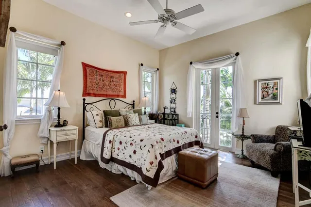 a bedroom with a bed couch and a window