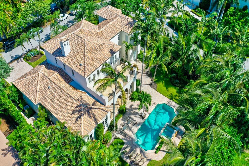 1054 Melaleuca Road Delray Beach, FL 33483 - Photo 26 of 26 an aerial view of a house with a yard and trees