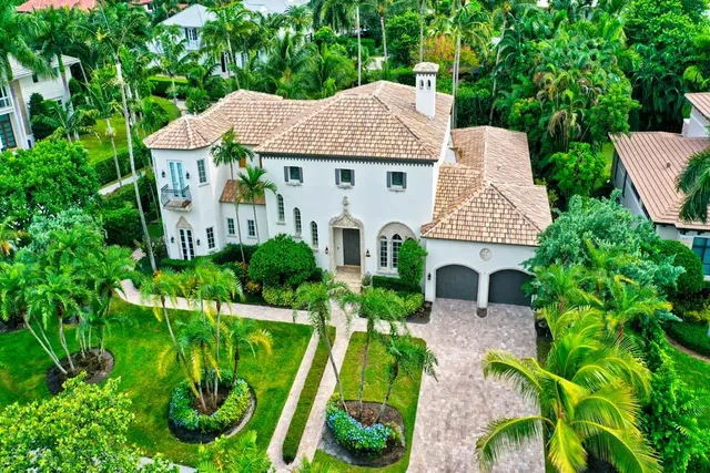 a aerial view of a house with garden space and street view