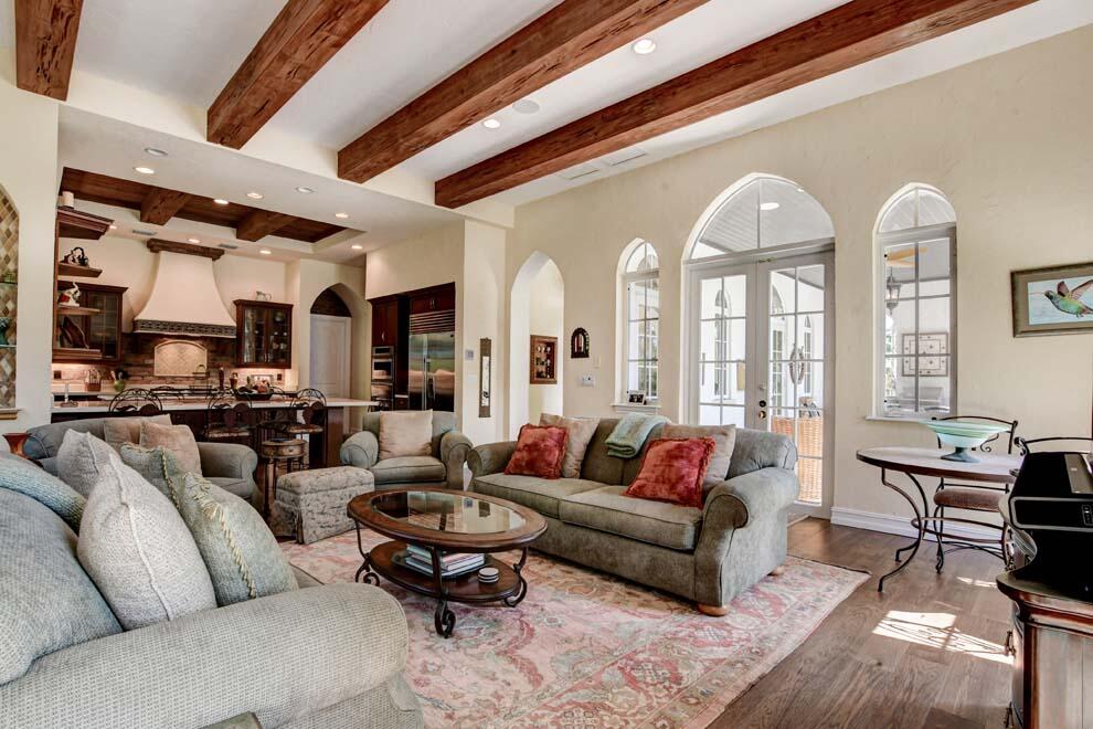 1054 Melaleuca Road Delray Beach, FL 33483 - Photo 10 of 26 a living room with furniture fireplace and a large window