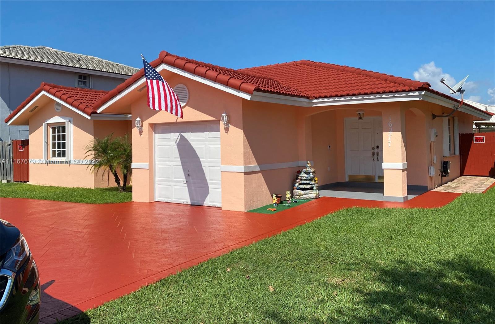 a front view of a house with yard