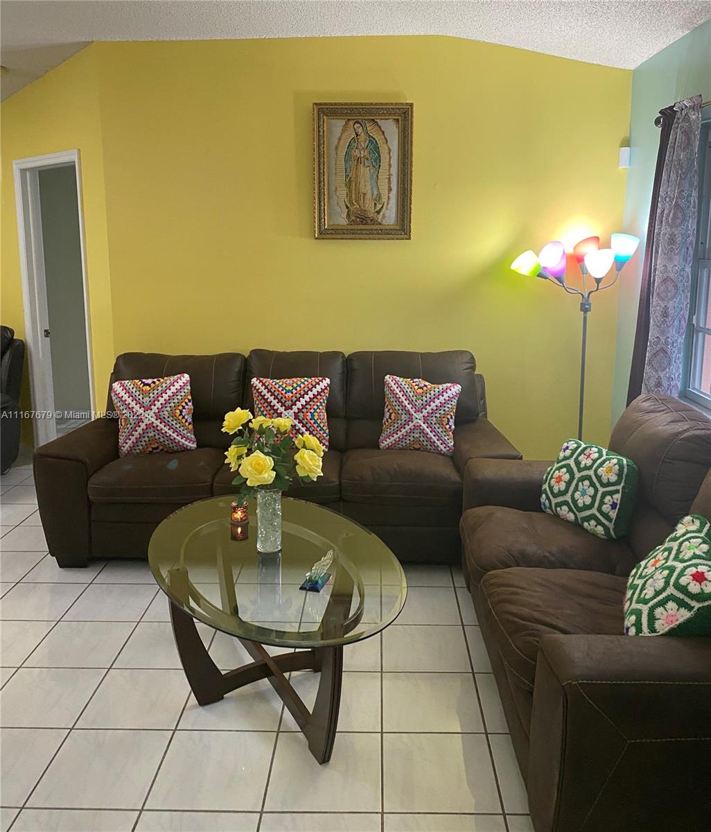 West Kendall Miami, FL 33193 - Photo 6 of 15 a living room with furniture and a potted plant