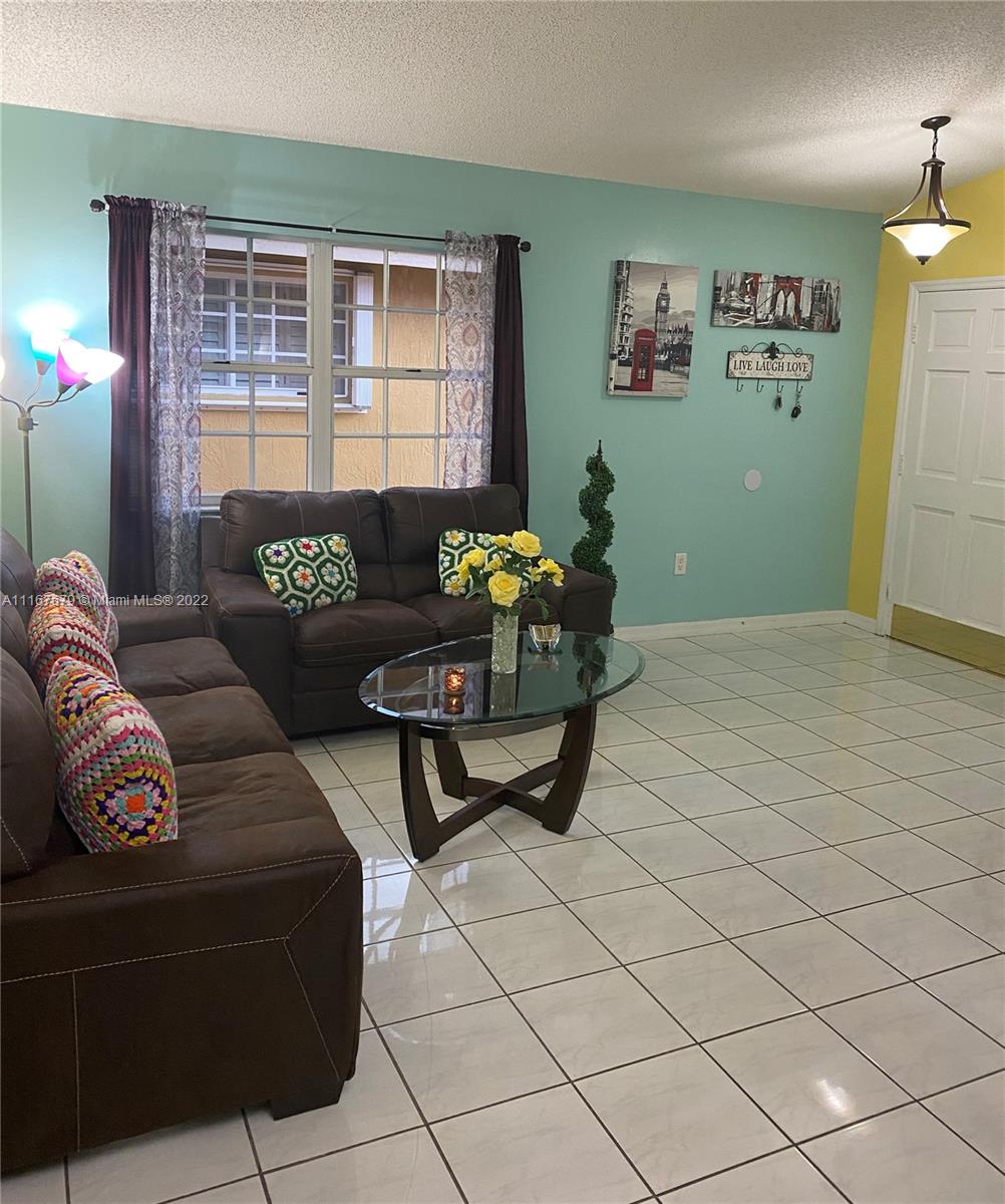 West Kendall Miami, FL 33193 - Photo 7 of 15 a living room with furniture and a potted plant