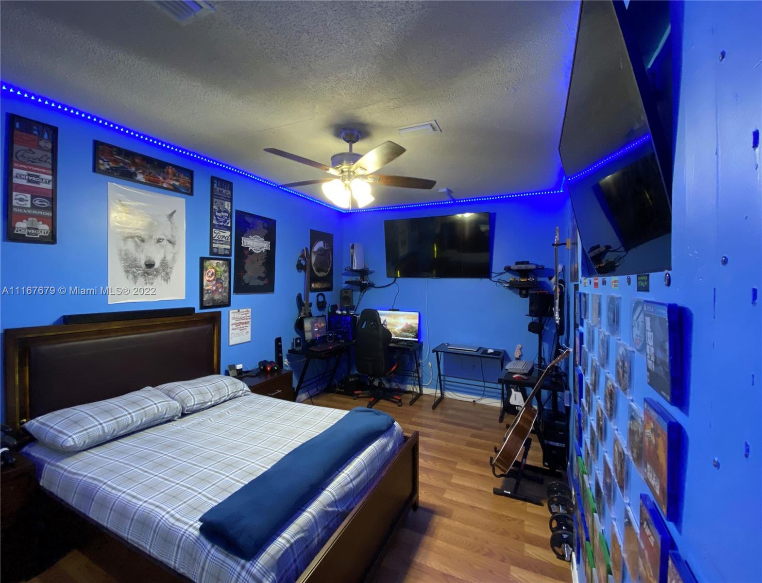 West Kendall Miami, FL 33193 - Photo 8 of 15 a bed room with a bed and a television