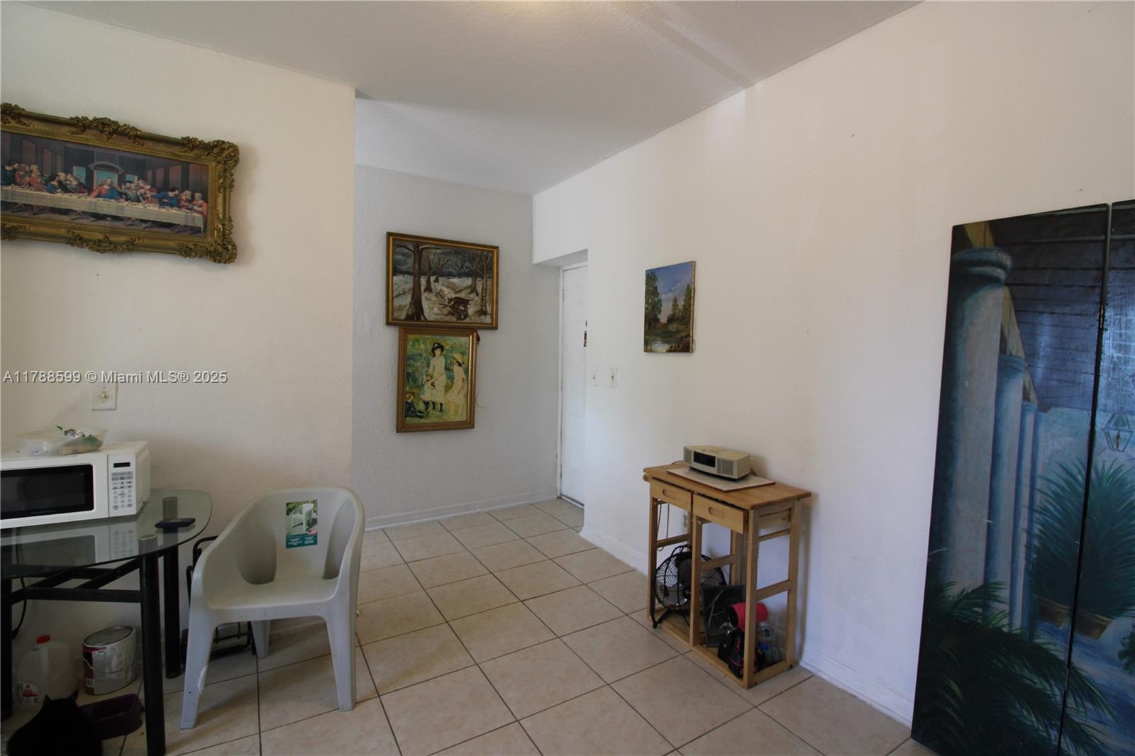 1021 Northwest 3rd Street, Unit 201 Miami, FL 33128 - Photo 12 of 27 a view of a workspace with furniture and a window