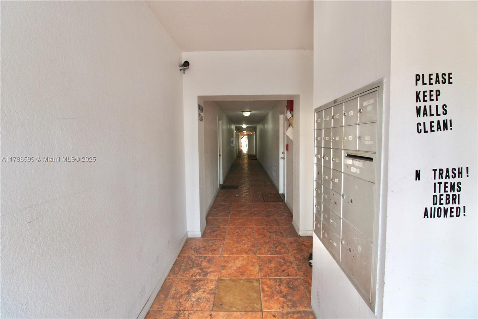 1021 Northwest 3rd Street, Unit 201 Miami, FL 33128 - Photo 16 of 27 a view of a hallway with wooden floor and closet