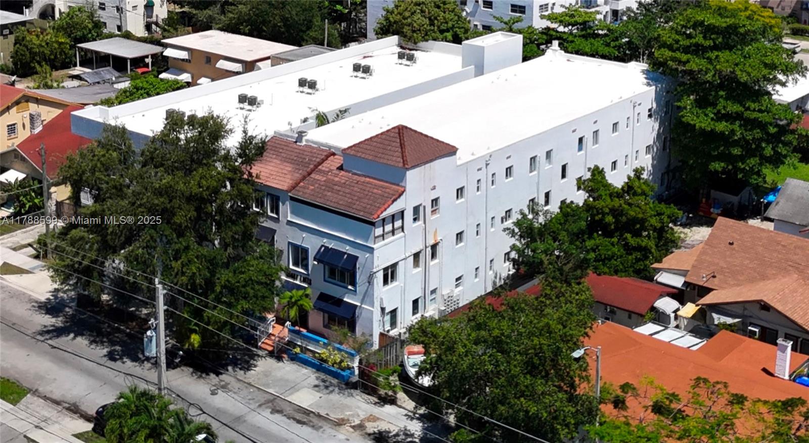 1021 Northwest 3rd Street, Unit 201 Miami, FL 33128 - Photo 24 of 27 an aerial view of multi story residential apartment building with yard