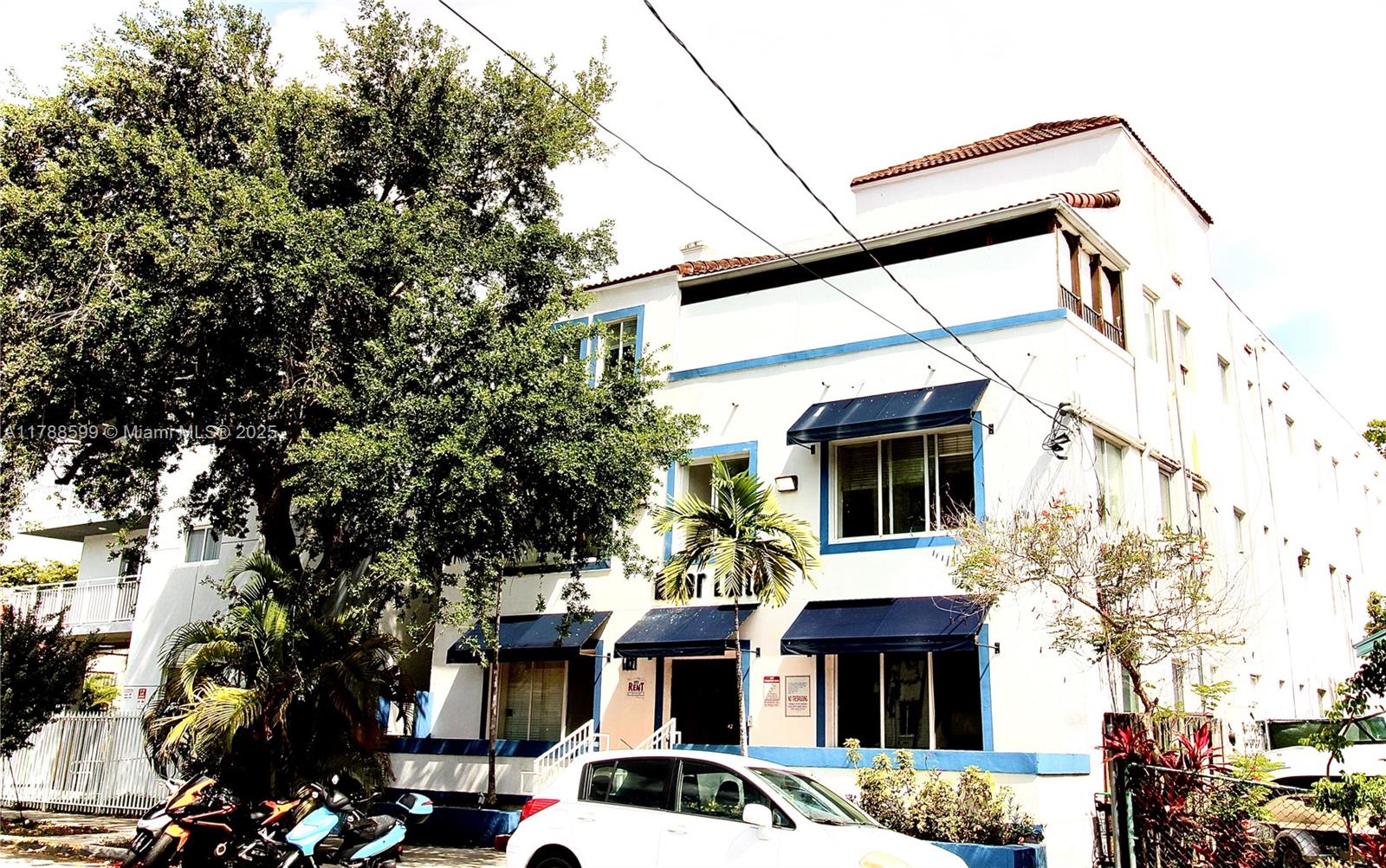 1021 Northwest 3rd Street, Unit 201 Miami, FL 33128 - Photo 27 of 27 a front view of a house with a yard