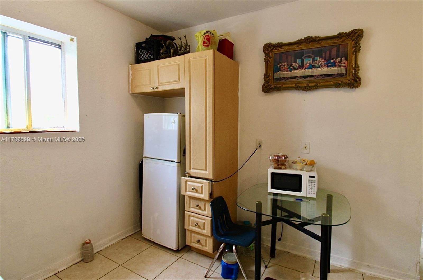 1021 Northwest 3rd Street, Unit 201 Miami, FL 33128 - Photo 4 of 27 a living room with furniture and a window