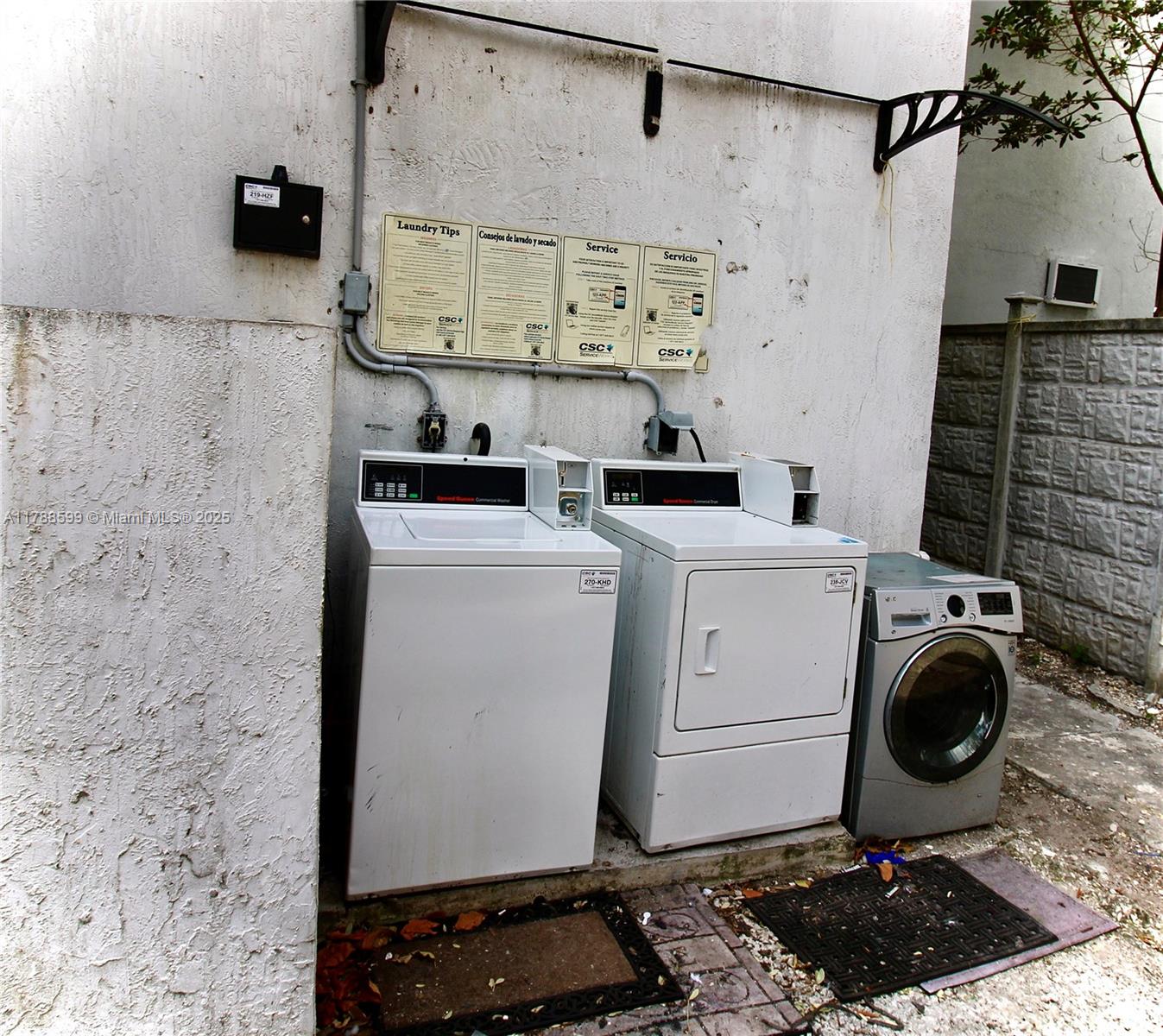 1021 Northwest 3rd Street, Unit 201 Miami, FL 33128 - Photo 8 of 27 a room with a stove and washing machine