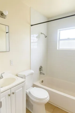 a bathroom with a sink toilet and a bathtub