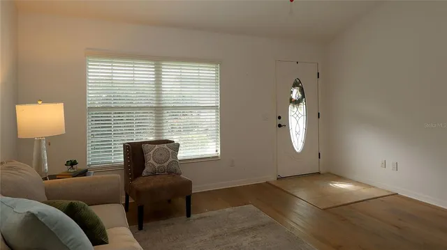 a living room with furniture and a window