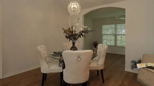 a dining room with furniture and window