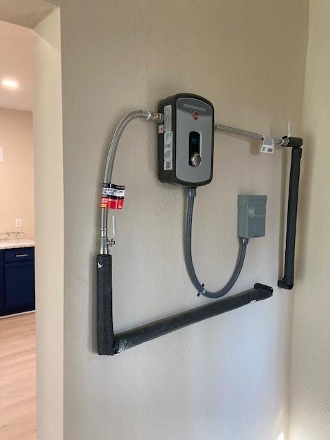 608 Turner Street Waco, TX 76704 - Photo 12 of 14 wooden floor view of a room with wooden floor and mirror