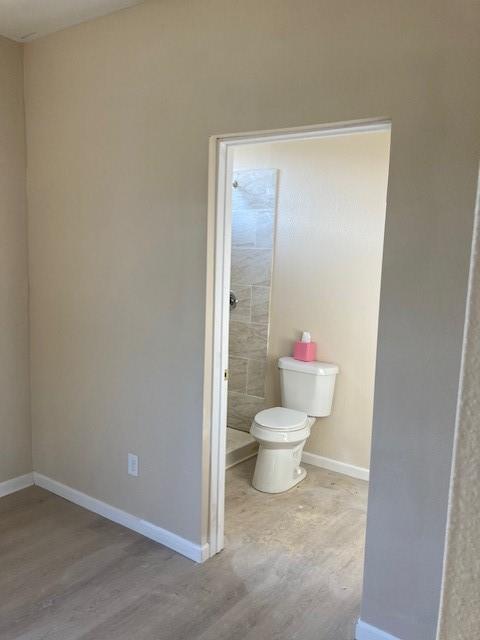 608 Turner Street Waco, TX 76704 - Photo 9 of 14 a white toilet sitting next to a bathroom sink
