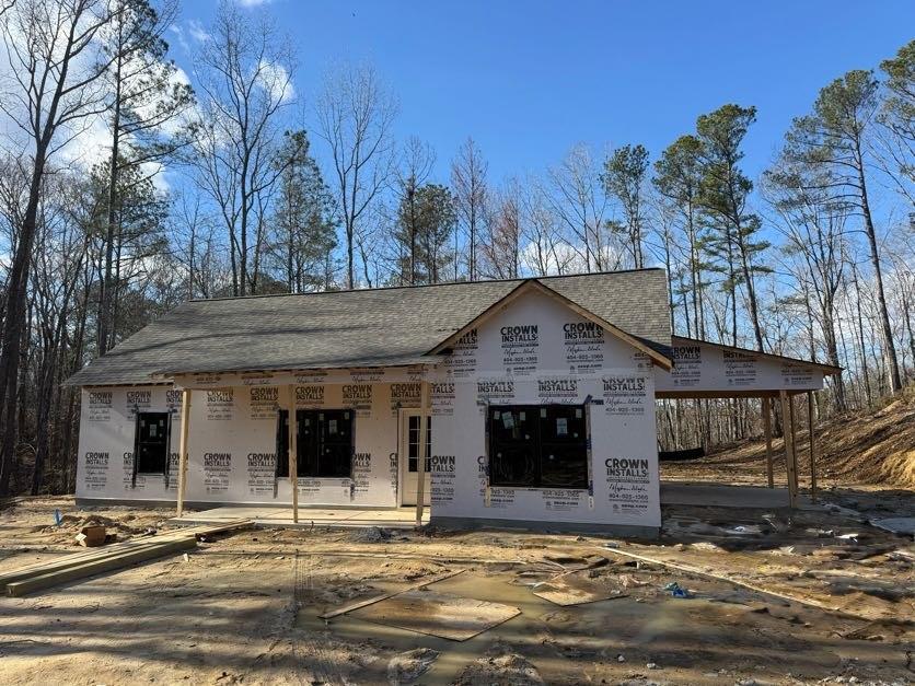 342 Dandy Road Dallas, GA 30132 - Photo 1 of 35 a view of a house with a large windows yard and a large tree