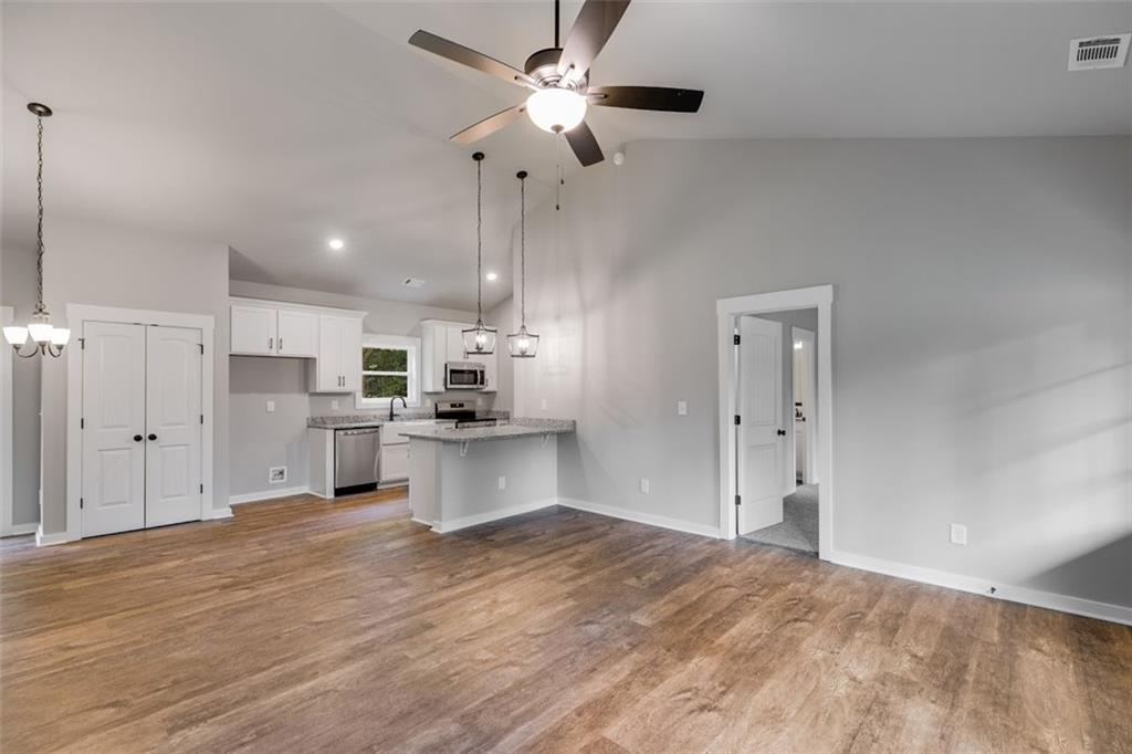 342 Dandy Road Dallas, GA 30132 - Photo 14 of 35 a view of kitchen with wooden floor and window