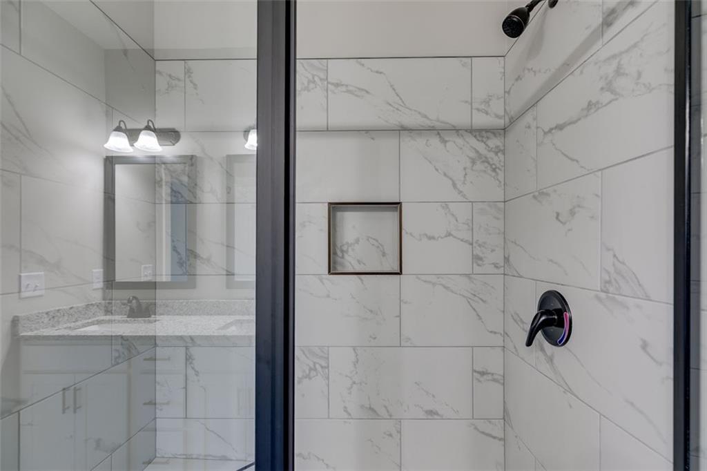 342 Dandy Road Dallas, GA 30132 - Photo 25 of 35 a bathroom with a shower and a sink