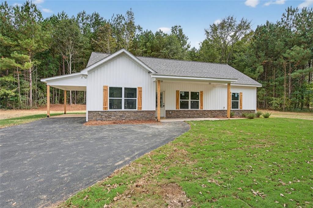 342 Dandy Road Dallas, GA 30132 - Photo 5 of 35 a view of a house with yard and tree s