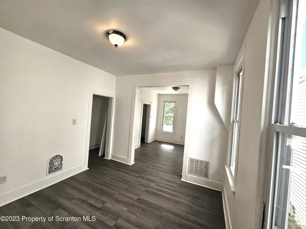 a view of entryway with wooden floor