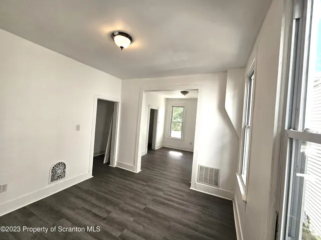 a view of entryway with wooden floor