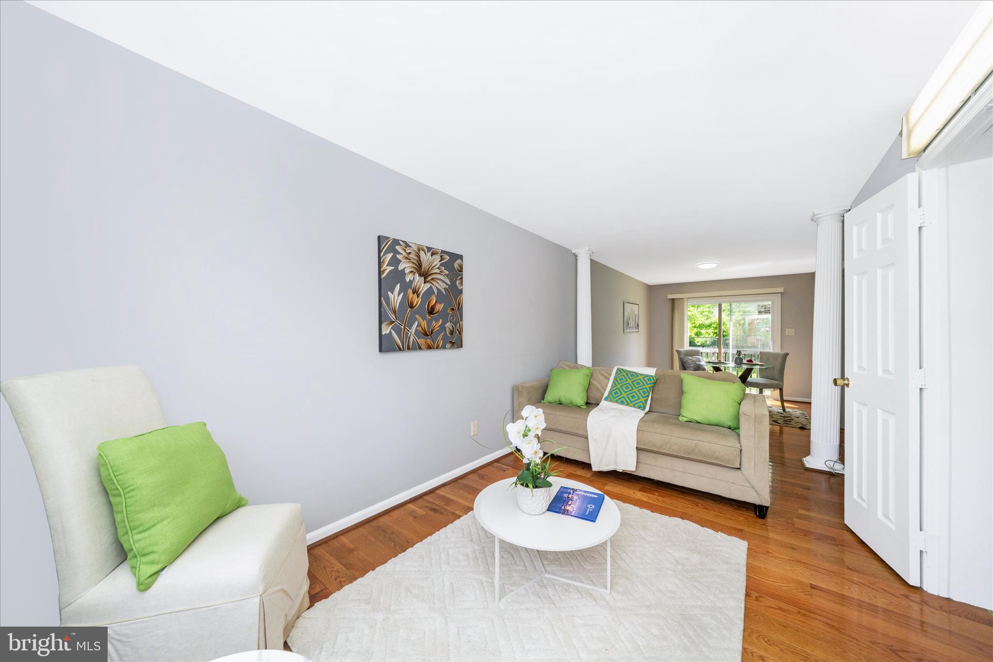 713 Seek Lane Silver Spring, MD 20912 - Photo 15 of 60 a living room with furniture and a wooden floor