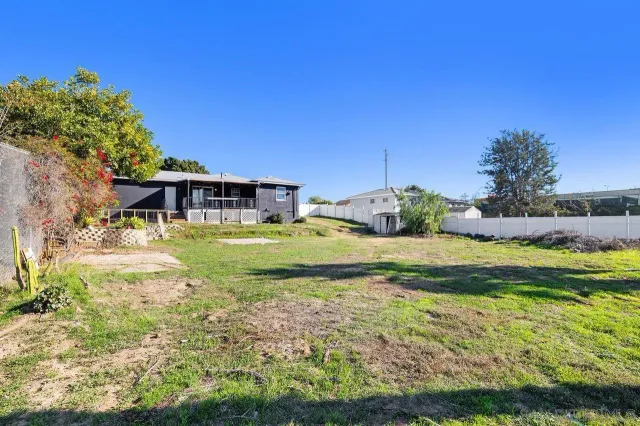 a view of a house with a big yard