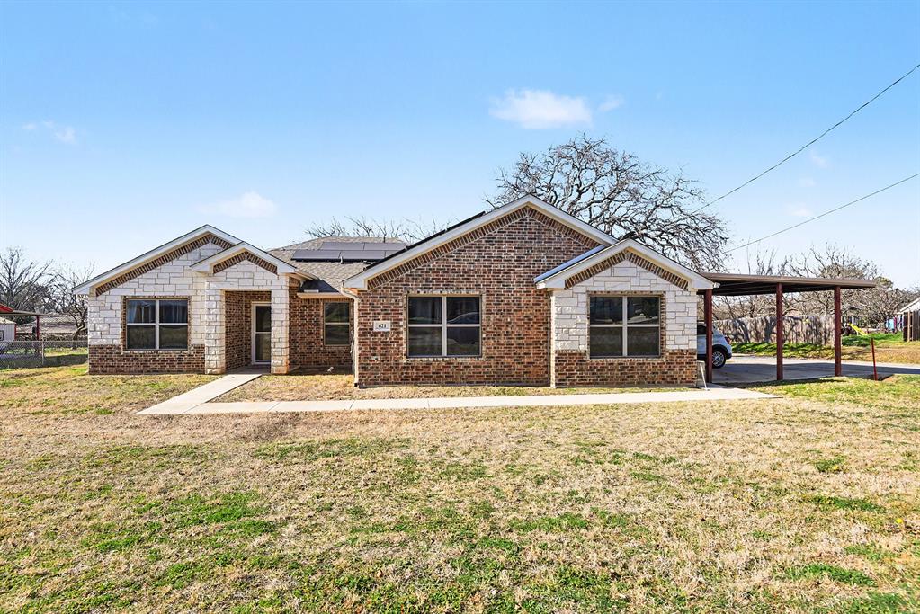 621 North Ave B Springtown, TX 76082 - Photo 1 of 28 a front view of a house with a yard
