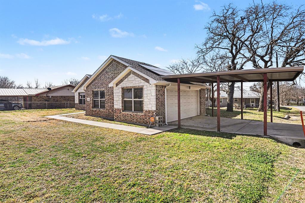 621 North Ave B Springtown, TX 76082 - Photo 2 of 28 a view of a house with swimming pool and sitting area