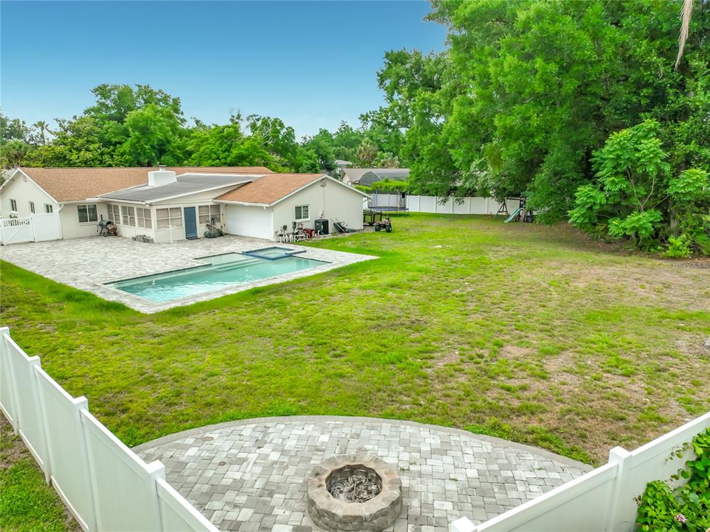 153 Variety Tree Circle Altamonte Springs, FL 32714 - Photo 40 of 44 swimming pool view with a garden