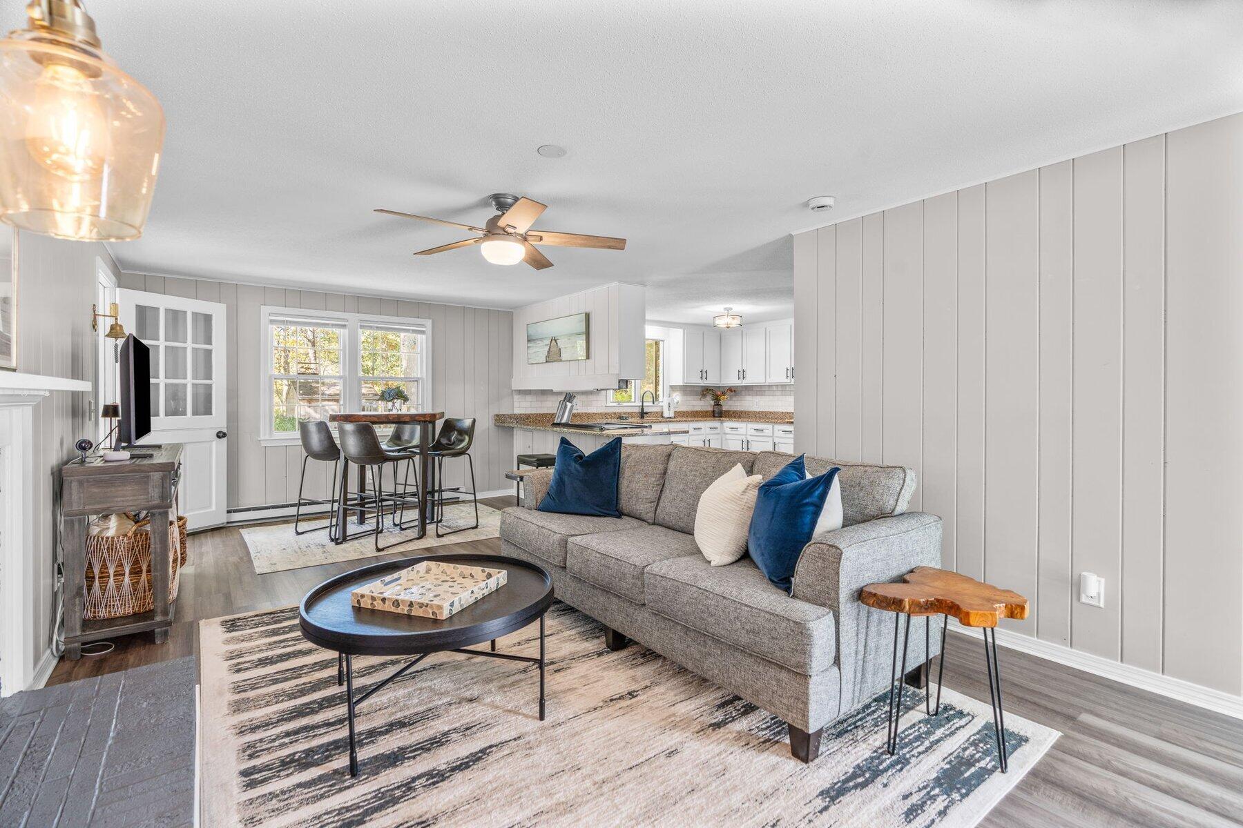 315 Prince Hinckley Road Centerville, MA 02632 - Photo 19 of 39 a living room with furniture a table and wooden floor
