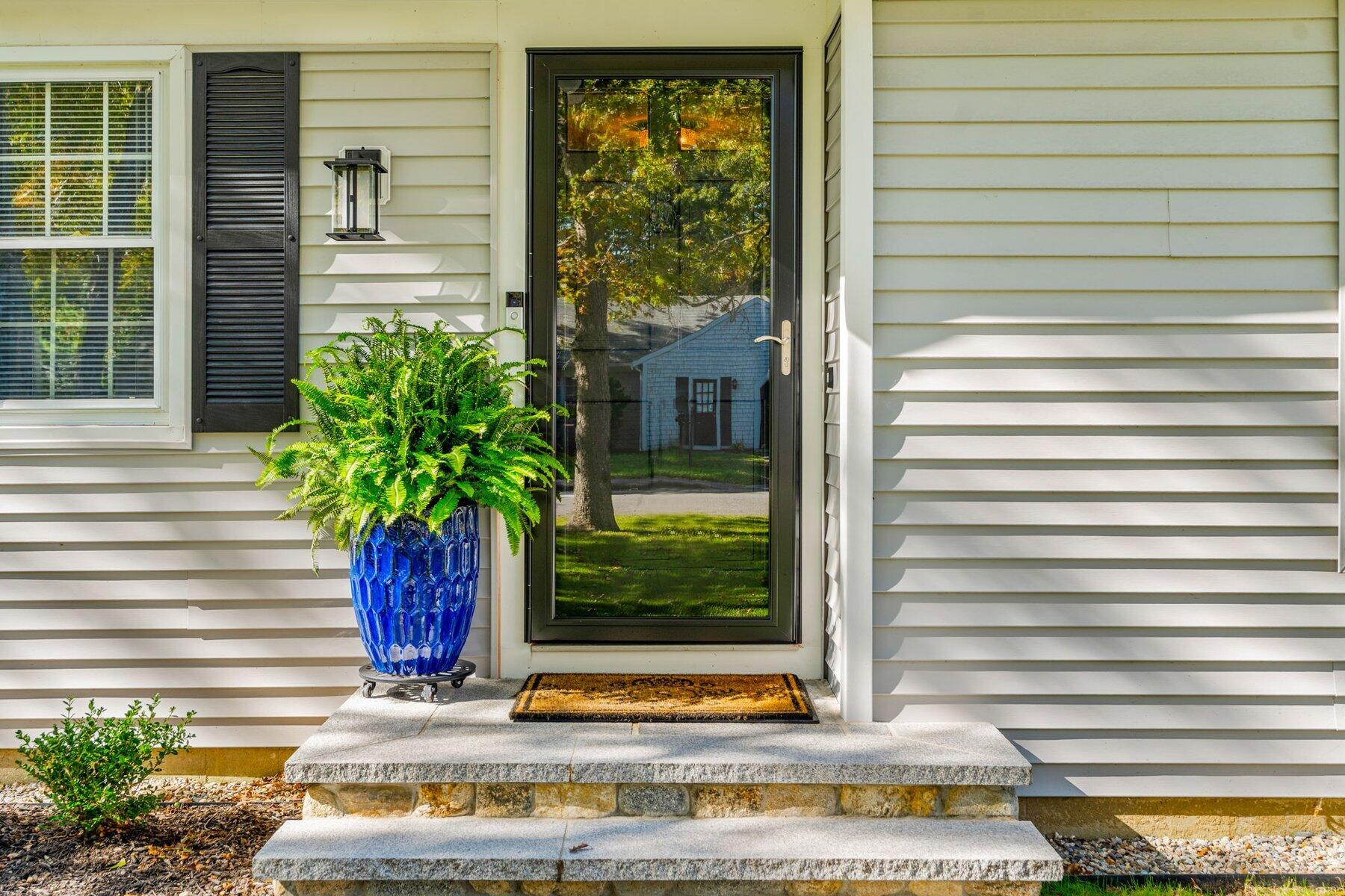 315 Prince Hinckley Road Centerville, MA 02632 - Photo 5 of 39 a front view of a house with a yard