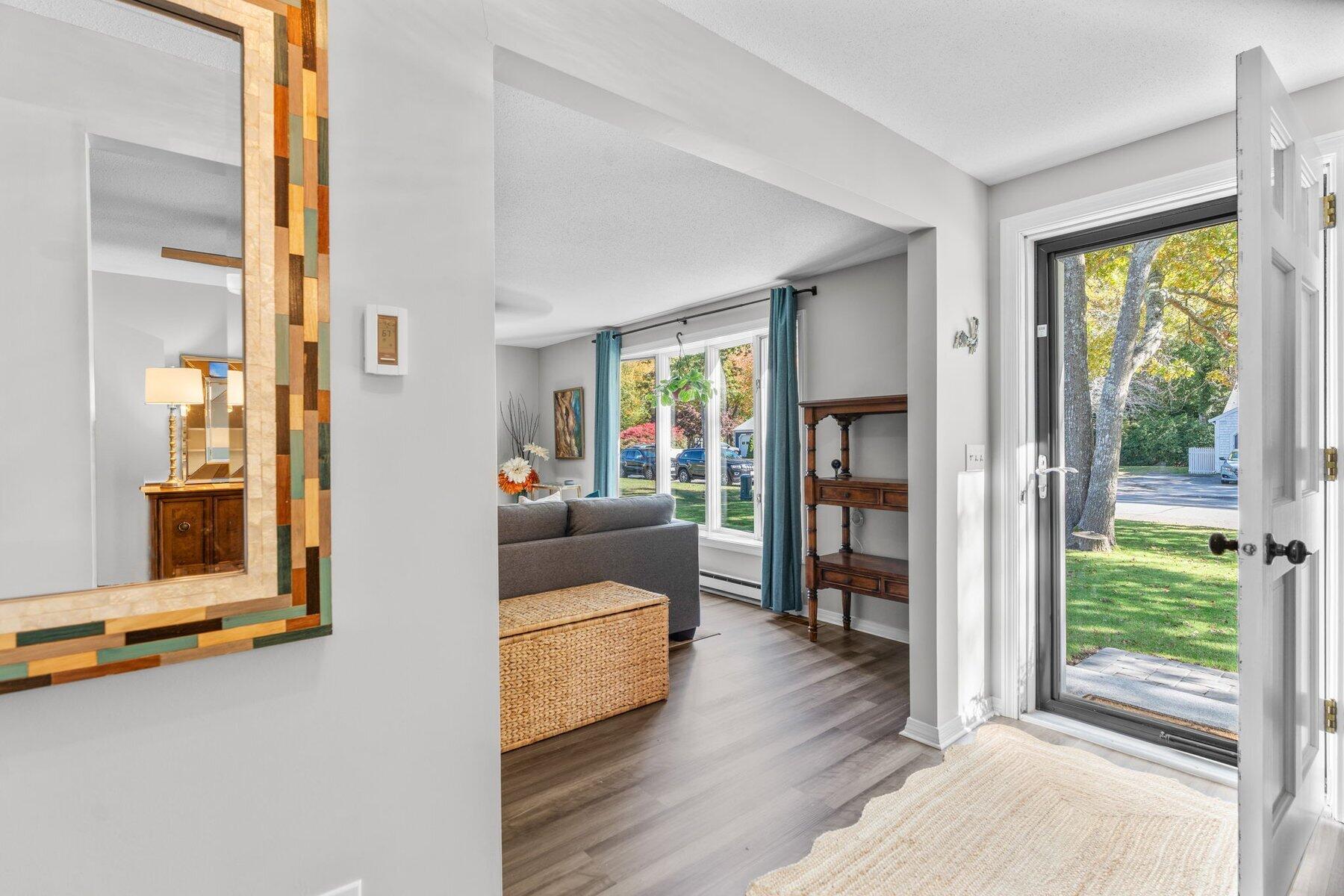 315 Prince Hinckley Road Centerville, MA 02632 - Photo 6 of 39 a living room with furniture and a large window