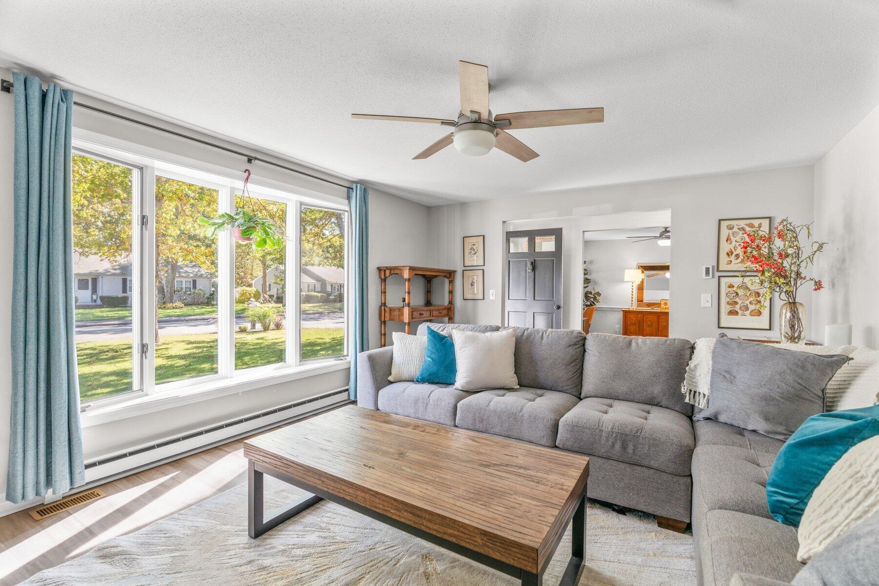 315 Prince Hinckley Road Centerville, MA 02632 - Photo 8 of 39 a living room with furniture and a large window