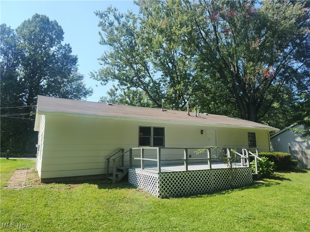 8016 Ninevah Road Geneva, OH 44041 - Photo 6 of 45 Back of property featuring a yard and a deck