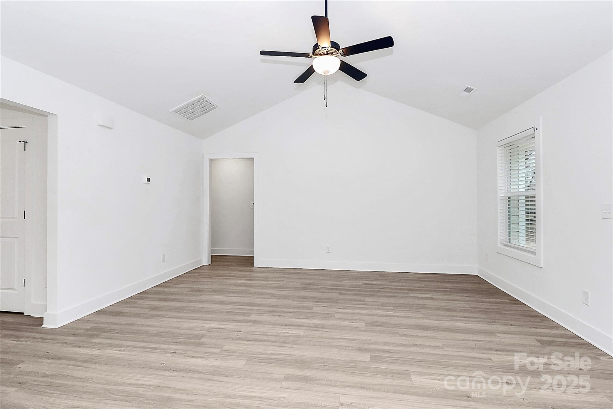 6259 Long Branch Road Salisbury, NC 28147 - Photo 16 of 48 a view of room with hardwood floor and a ceiling fan