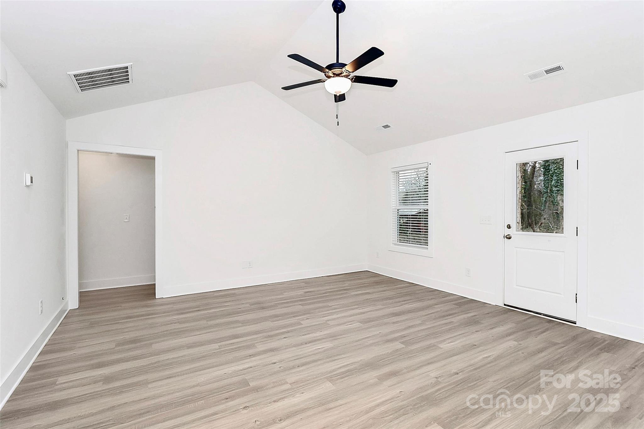 6259 Long Branch Road Salisbury, NC 28147 - Photo 17 of 48 a view of room with wooden floor and ceiling fan